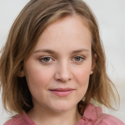 Joyful white child female with medium  brown hair and blue eyes