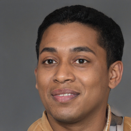 Joyful latino young-adult male with short  brown hair and brown eyes