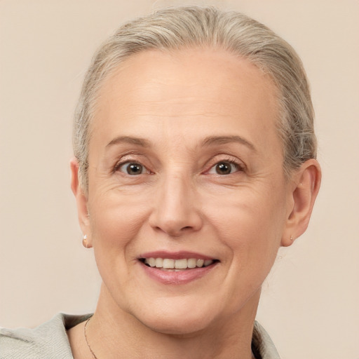 Joyful white adult female with short  brown hair and brown eyes