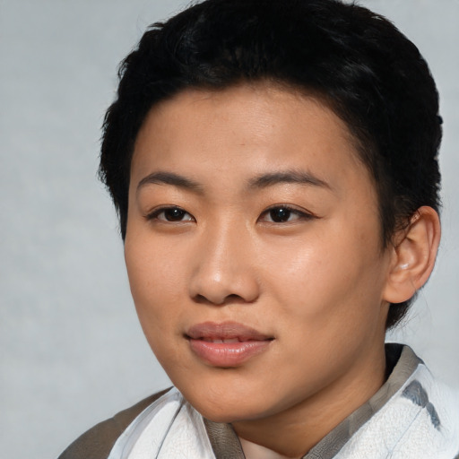 Joyful asian young-adult female with short  black hair and brown eyes