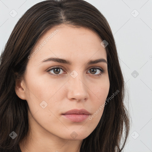 Neutral white young-adult female with long  brown hair and brown eyes