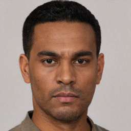 Neutral latino young-adult male with short  black hair and brown eyes