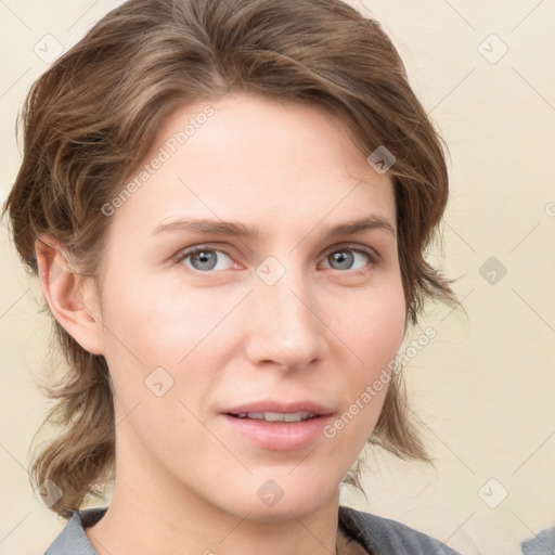 Joyful white young-adult female with medium  brown hair and blue eyes