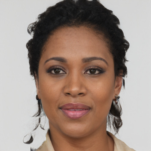 Joyful black young-adult female with medium  black hair and brown eyes