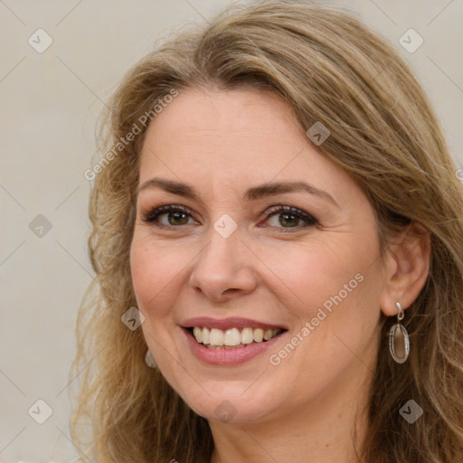 Joyful white adult female with long  brown hair and brown eyes