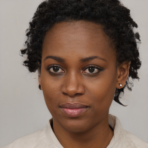 Neutral black young-adult female with short  black hair and brown eyes