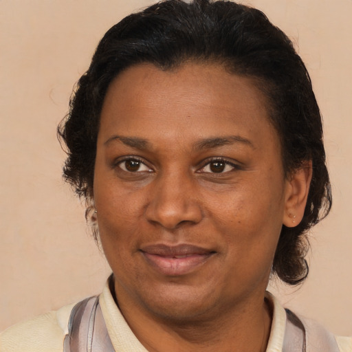 Joyful latino adult female with short  brown hair and brown eyes