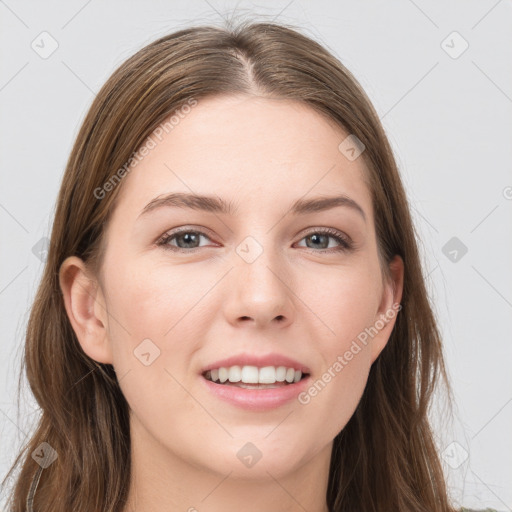 Joyful white young-adult female with long  brown hair and grey eyes