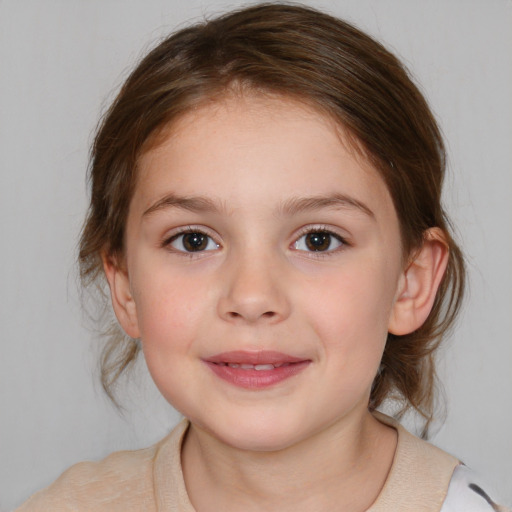 Joyful white child female with medium  brown hair and brown eyes