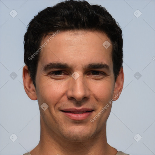 Joyful white young-adult male with short  black hair and brown eyes