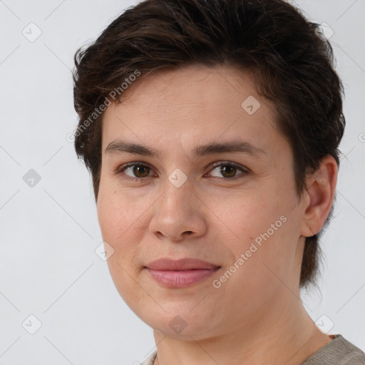 Joyful white young-adult female with short  brown hair and brown eyes