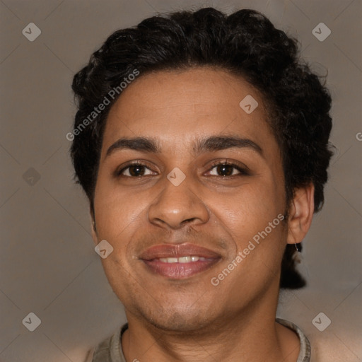 Joyful black adult male with short  brown hair and brown eyes