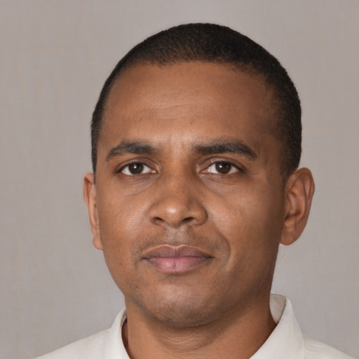 Neutral black adult male with short  black hair and brown eyes