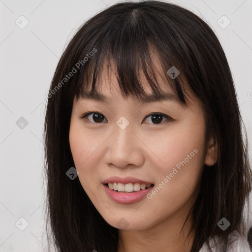 Joyful asian young-adult female with long  brown hair and brown eyes