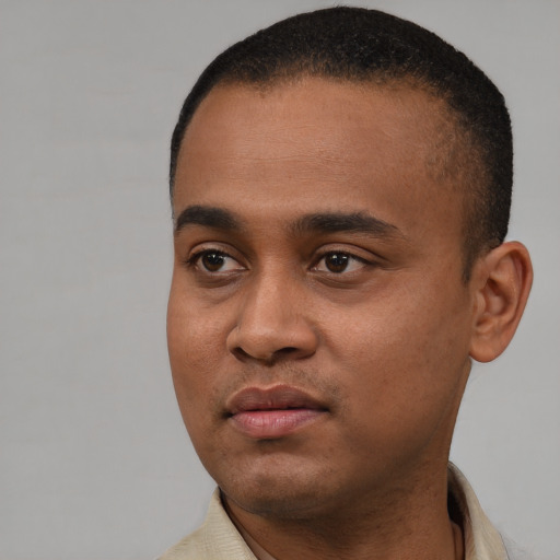 Neutral black young-adult male with short  black hair and brown eyes