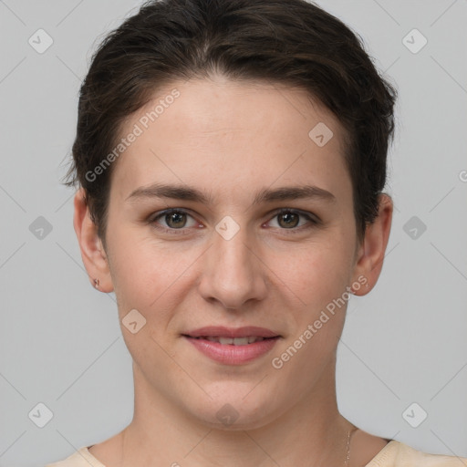 Joyful white young-adult female with short  brown hair and grey eyes