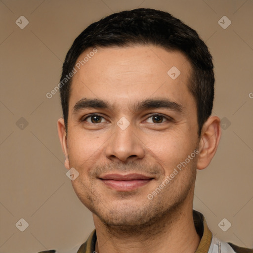 Joyful white young-adult male with short  black hair and brown eyes