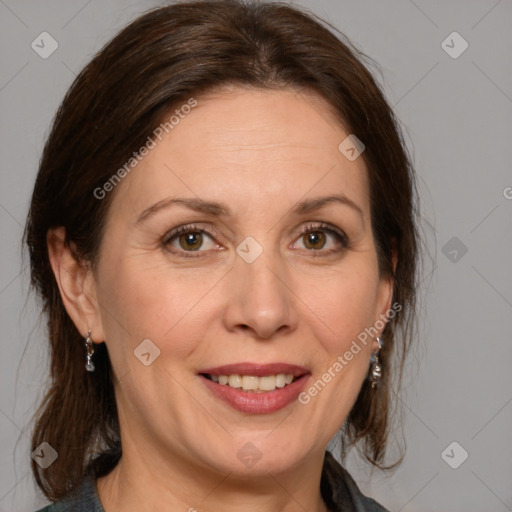 Joyful white adult female with medium  brown hair and grey eyes