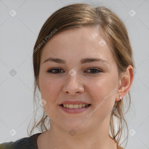 Joyful white child female with medium  brown hair and brown eyes