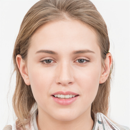 Joyful white young-adult female with medium  brown hair and blue eyes