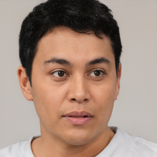 Neutral latino young-adult male with short  black hair and brown eyes