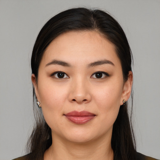 Joyful white young-adult female with medium  brown hair and brown eyes
