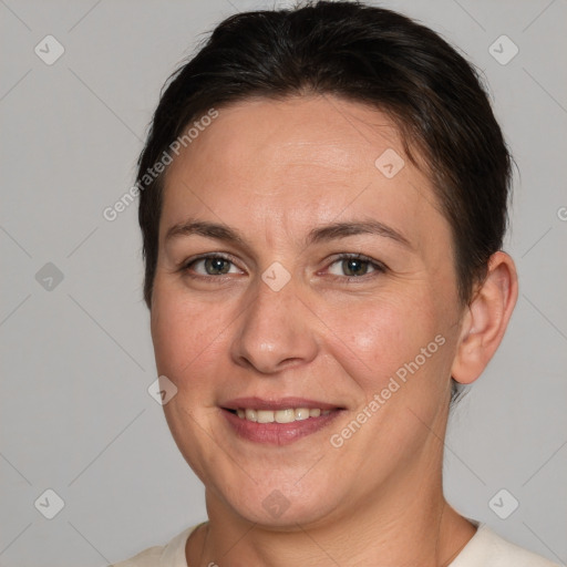 Joyful white adult female with short  brown hair and brown eyes