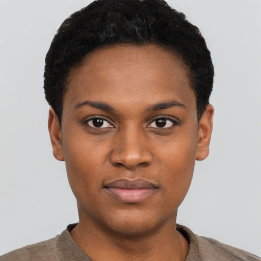 Joyful black young-adult female with short  black hair and brown eyes
