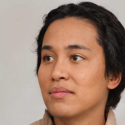 Neutral black young-adult female with medium  brown hair and brown eyes