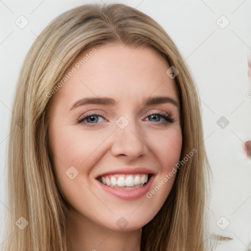 Joyful white young-adult female with long  brown hair and blue eyes