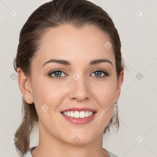 Joyful white young-adult female with medium  brown hair and grey eyes