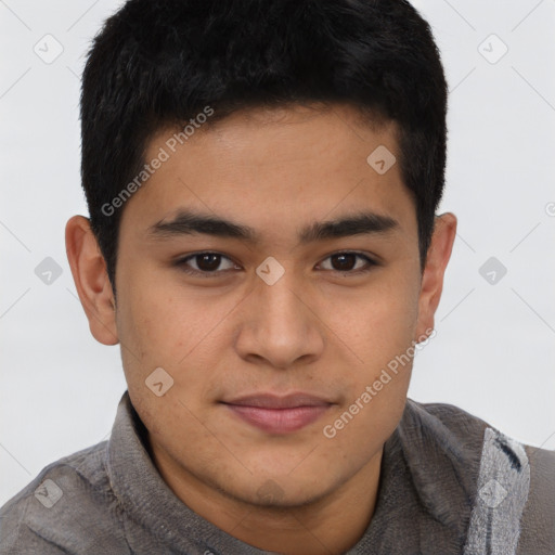 Joyful latino young-adult male with short  brown hair and brown eyes