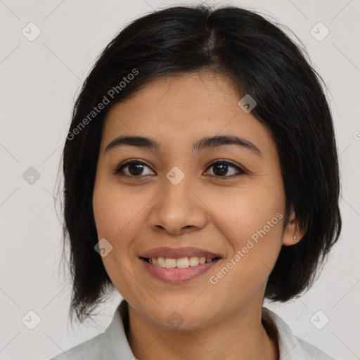 Joyful asian young-adult female with medium  black hair and brown eyes