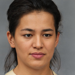 Joyful asian young-adult female with medium  brown hair and brown eyes