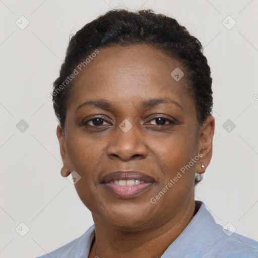 Joyful black adult female with short  brown hair and brown eyes