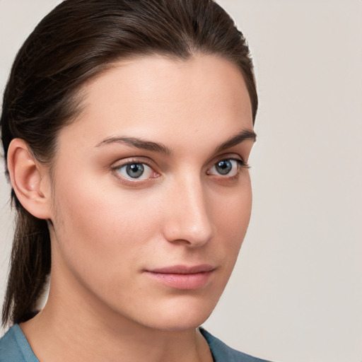 Neutral white young-adult female with medium  brown hair and grey eyes