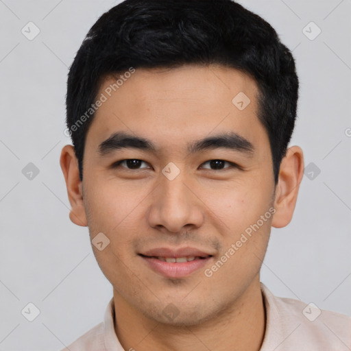 Joyful asian young-adult male with short  black hair and brown eyes