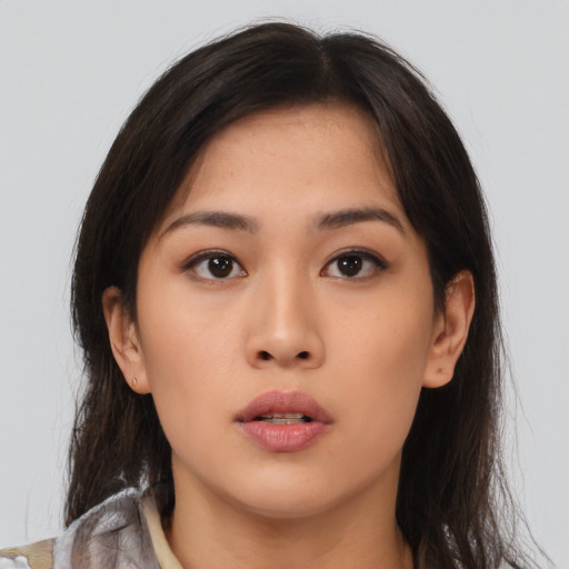 Neutral asian young-adult female with medium  brown hair and brown eyes