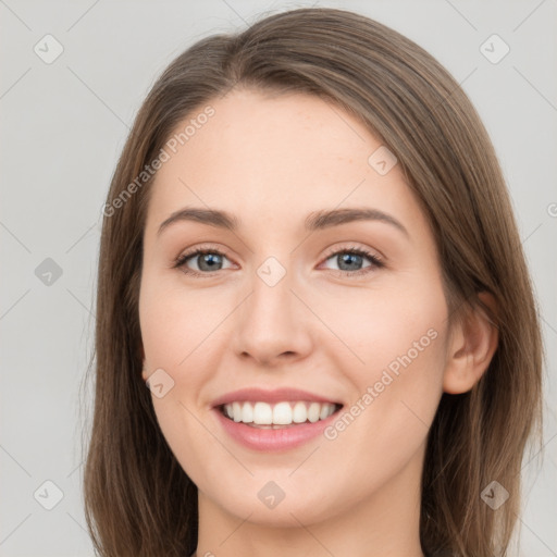 Joyful white young-adult female with long  brown hair and grey eyes