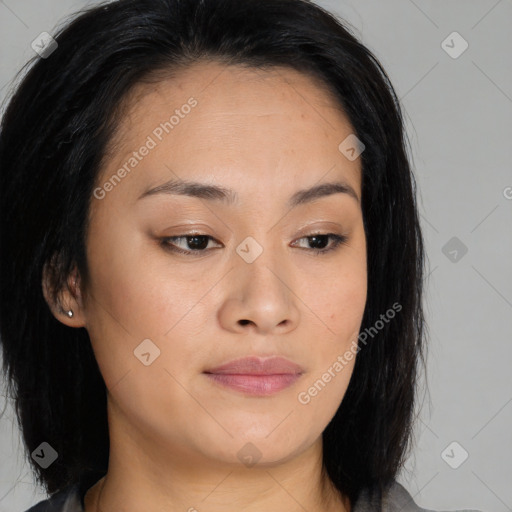 Joyful asian young-adult female with medium  brown hair and brown eyes