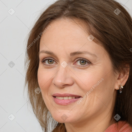 Joyful white adult female with medium  brown hair and grey eyes