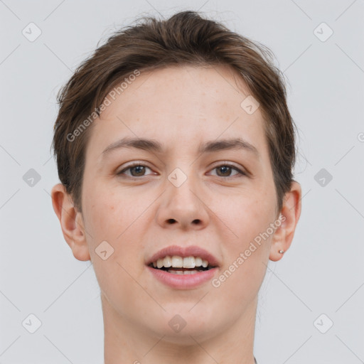 Joyful white young-adult female with short  brown hair and grey eyes