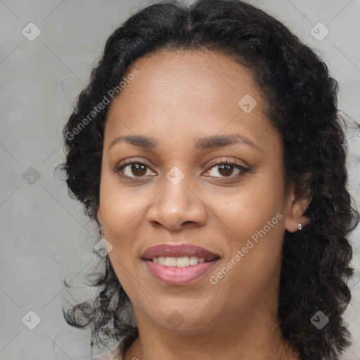 Joyful latino adult female with medium  brown hair and brown eyes