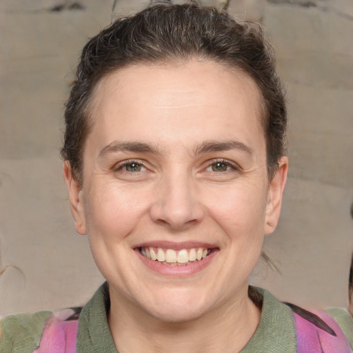 Joyful white adult female with short  brown hair and brown eyes