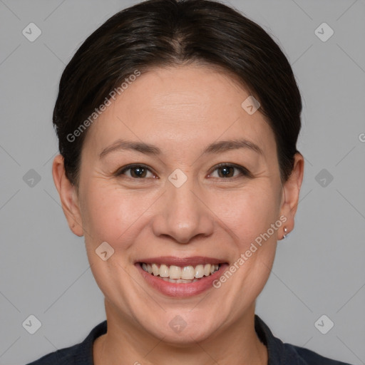 Joyful white adult female with short  brown hair and brown eyes