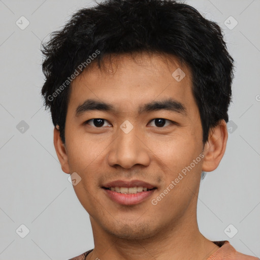 Joyful asian young-adult male with short  black hair and brown eyes