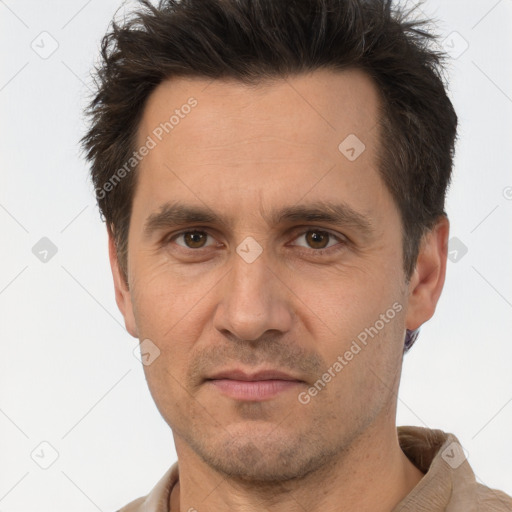 Joyful white adult male with short  brown hair and brown eyes