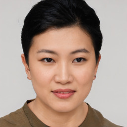 Joyful asian young-adult female with short  black hair and brown eyes