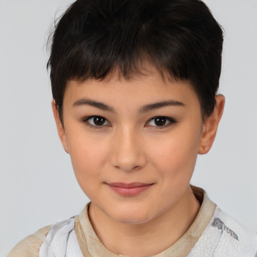 Joyful asian child female with short  brown hair and brown eyes