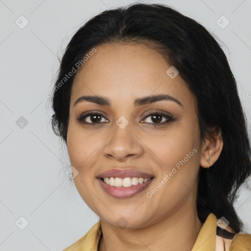 Joyful latino young-adult female with long  brown hair and brown eyes